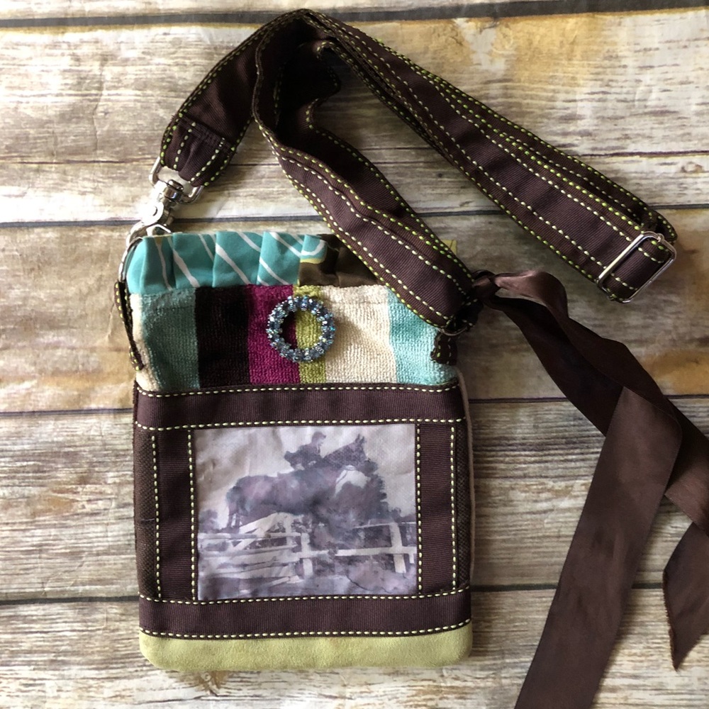 Small Rebecca Ray tote bag with horse print.